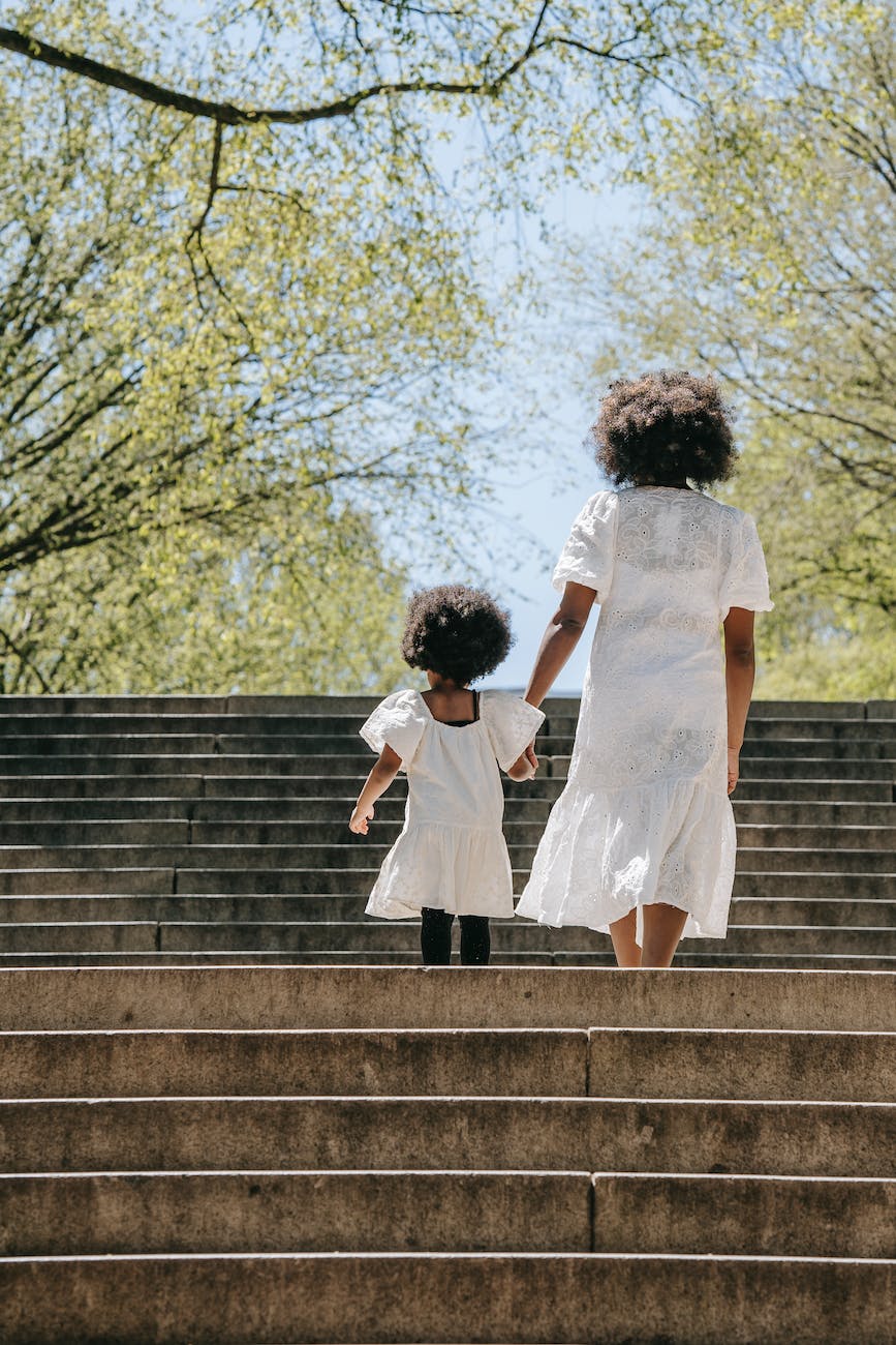 a woman walking in a stairway with her daughter