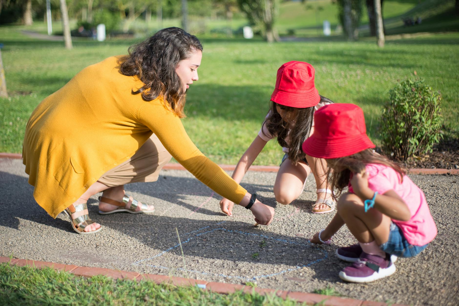 close up shot of girls playing with their nanny